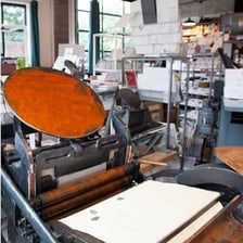 A traditional printing press in a workshop
