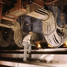 Molten metal being produced in an industrial smelting furnace.