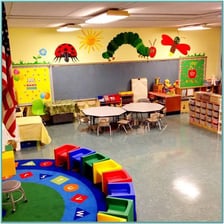 A young child in a preschool classroom