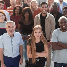 A group of people standing united together