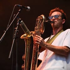 A Jamaican ska band performing with horn instruments