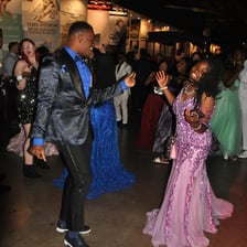 High-school seniors dressed formally at a prom.