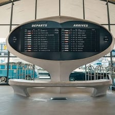 An airport flight display listing estimated arrival times