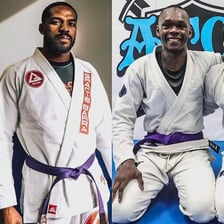 Judo practitioners wearing martial arts belts