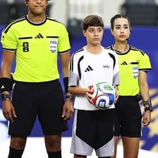 Soccer referees Tori Penso and Katia Itzel García on the field