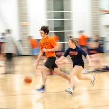 Students participating in a sports game within their school community.