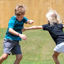 Children running while playing a game of tag