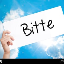 A sign displaying the German word “Bitte,” meaning “please.”