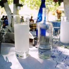 A glass of ouzo served at a Greek taverna.