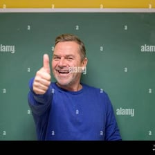 A person giving a thumbs-up gesture to indicate that an answer is correct.