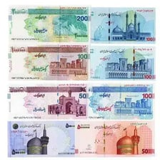 Iranian rial banknotes displayed together.