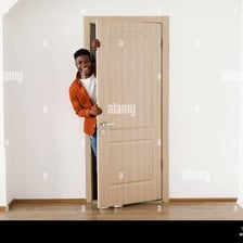 A person leaving through a doorway