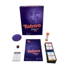 Taboo party game cards and timer on a table