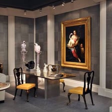 Paintings displayed on the walls of a museum gallery.