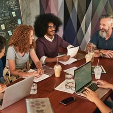 A group of people collaborating smoothly on a shared task