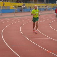 Runners competing on an oval track