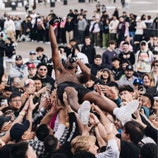 A crowded concert with a visibly energetic audience