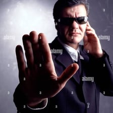 A person giving a dismissive reaction during conversation.