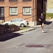 A person running quickly down a street