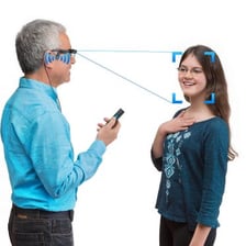 A person looking at a face while trying to identify it.