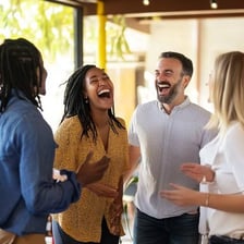 A group of people laughing together in a shared moment