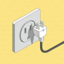 An electrical plug inserted into a wall socket