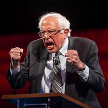 A visibly passionate person speaking with energetic expression.