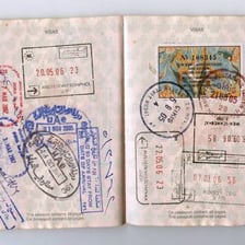 A passport page bearing an official visa stamp.
