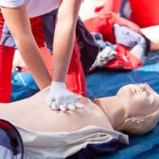 Emergency medical technicians performing CPR on a patient