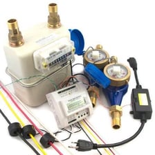 Natural gas and electric utility meters at a home