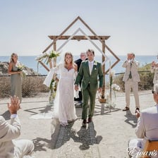A wedding ceremony taking place at an altar.