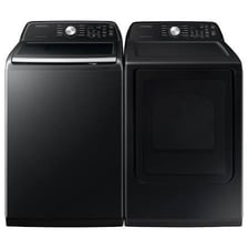 A Samsung clothes dryer in a laundry room.