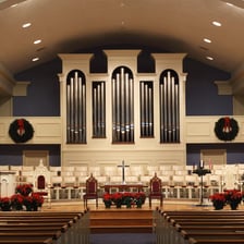 A large pipe organ installed in a church.