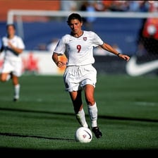 Mia Hamm playing in a soccer match