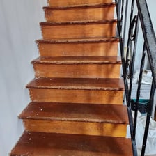A staircase with visibly worn steps from repeated use.