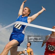 A runner falling short of a finish line