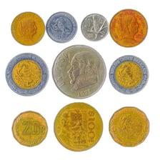 Mexican peso coins arranged on a surface