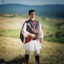 People in traditional Bulgarian clothing at a cultural festival
