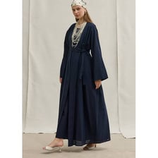 A long, loose abaya robe worn as modest clothing.