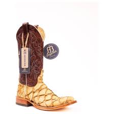 Cowboy boots and a Western saddle representing Texas gear.