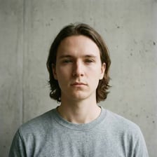 A person maintaining a calm, expressionless face