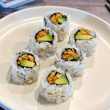 Sliced sushi rolls filled with avocado