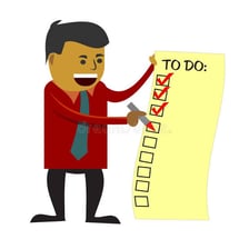 A person marks a completed task on a checklist.
