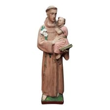 A statue of a female saint in a church.