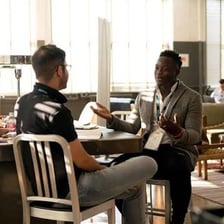 A person speaking during a conversation.