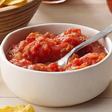 Bowls of salsa labeled mild, medium, and hot