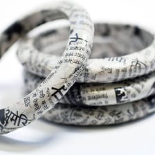 A bangle bracelet shown beside a newspaper story illustration representing an angle.