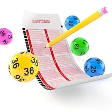 A losing lottery ticket beside a simple zero symbol.