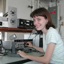 An amateur radio operator working at a communications desk