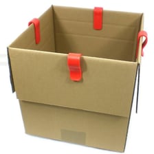 An open cardboard carton with its flaps raised